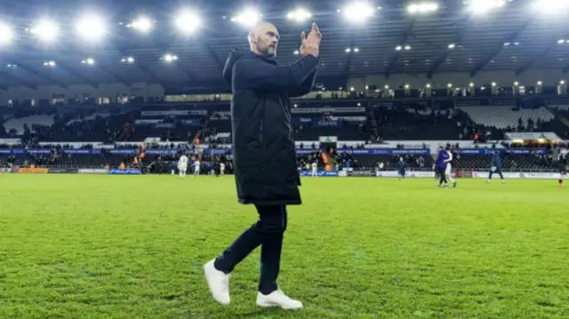 Swansea City head coach Luke Williams applauds