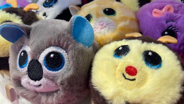 A selection of Ty Beanie Bouncer toys are pictured together. They are round and fluffy. One is a koala and another is a bee.