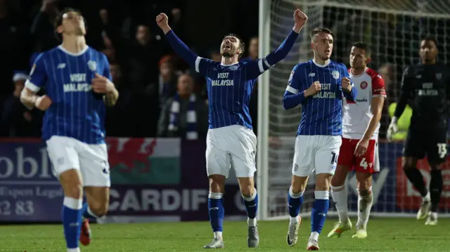 Calum Chambers leads celebrations after Cardiff's win at Stevenage 