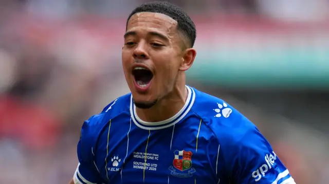 Dom Hutchinson in blue Wealdstone shirt 
