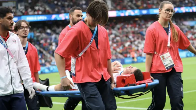 Enzo Gonzalez carried off on a stretcher