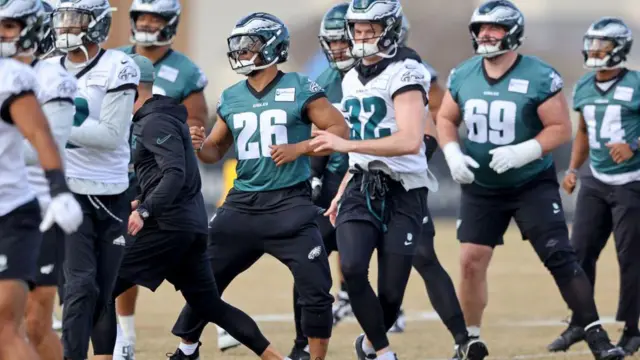 Philadelphia Eagles players warm up at practice before Super Bowl 59