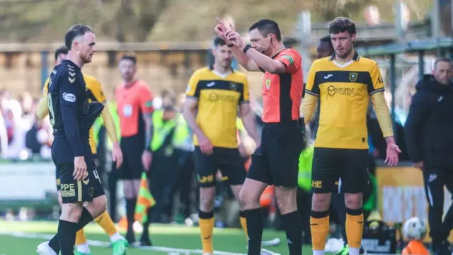 Marc Leonard was sent off after Kevin Clancy reviewed the incident via the pitchside monitor