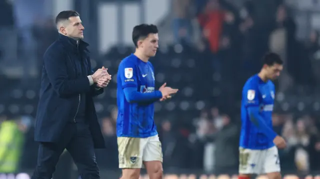 Portsmouth boss John Mousinho applauding fans