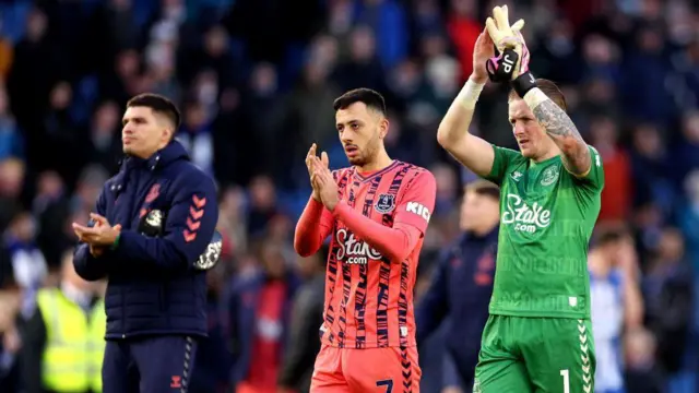 Dwight McNeil and Jordan Pickford of Everton applaud the fans