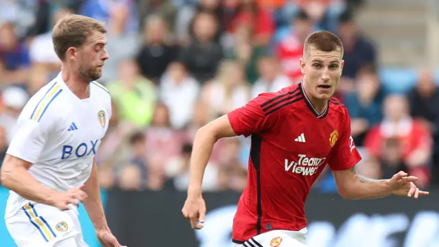 Rhys Bennett and Patrick Bamford in action in pre-season match between Leeds United and Manchester United