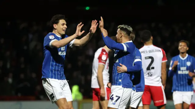 Callum Robinson celebrates with Yousef Salech 