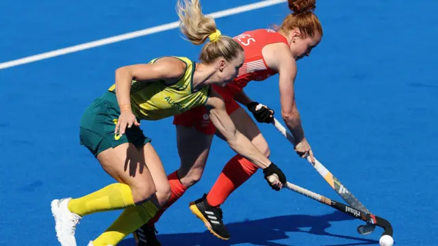 Stephanie Kershaw of Team Australia tackles Sarah Jones of Team Great Britain during the Women's Pool B match between Great Britain and Australia on day three of the Olympic Games