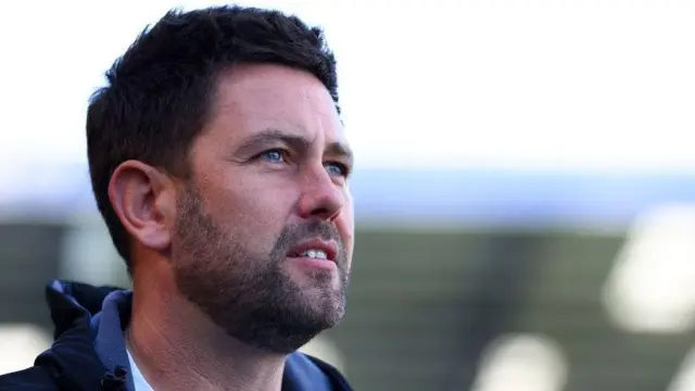 Oxford United manager Des Buckingham looks on from the touchline against Portsmouth