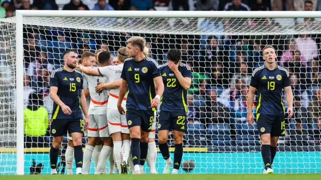 Scotland players look on 