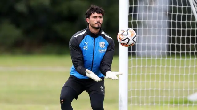 Brad Foster catches the ball while training with West Brom