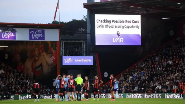 A general view of the LED board at Vitality Stadium displaying a VAR review message before William Saliba's red card