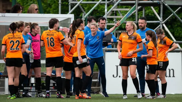 Glasgow City Manager Leanne Ross speaks with her players during a Scottish Women's Premier League match between Glasgow City and Rangers