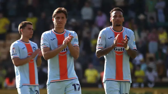 Leo Walta, Goncalo Franco and Ronald applaud Swansea fans at Norwich 