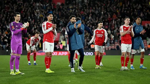 Players of Arsenal applaud the fans following their team's defeat in the FA Cup against Southampton