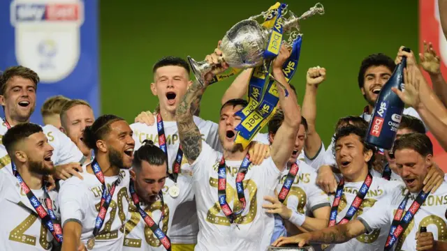 Liam Cooper lifting the Championship trophy