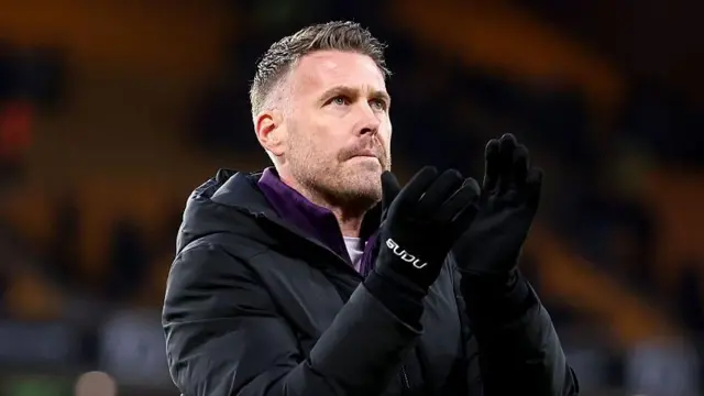 Rob Edwards applauds the Wolverhampton Wanderers supporters following his team's 2-0 Premier League defeat at home to Bournemouth