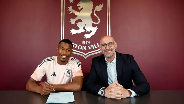 Zepiqueno Redmond of Aston Villa poses for a picture with President of Football Operations Monchi