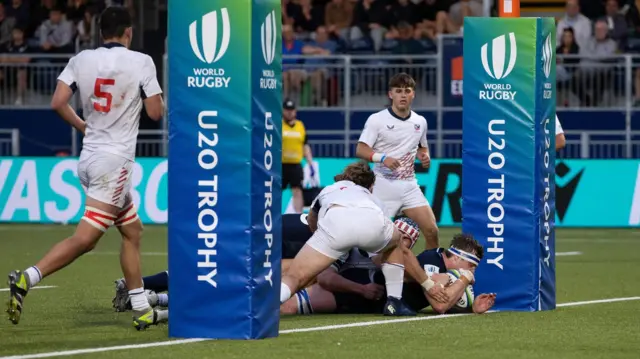 Scotland's Euan McVie scores a try