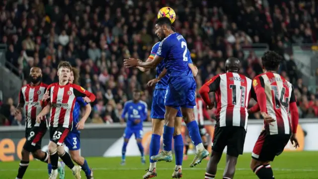 Leicester City's Conor Coady and James Justin clear the ball from a cross during the Premier League match between Brentford FC and Leicester City FC at Gtech Community Stadium