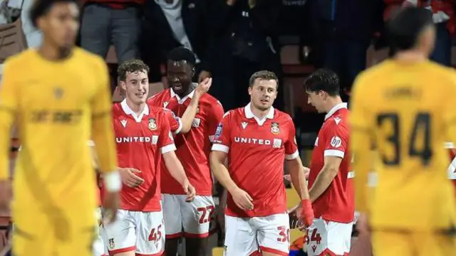 Wrexham celebrate during their EFL Trophy win over Wolverhampton Wanderers Under-21s