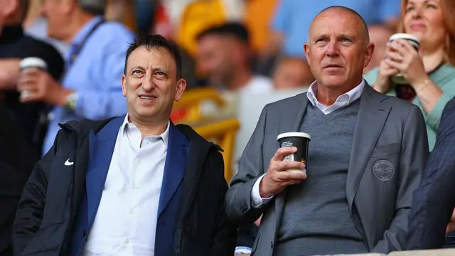 Tony Bloom and Paul Barber stand alongside one another