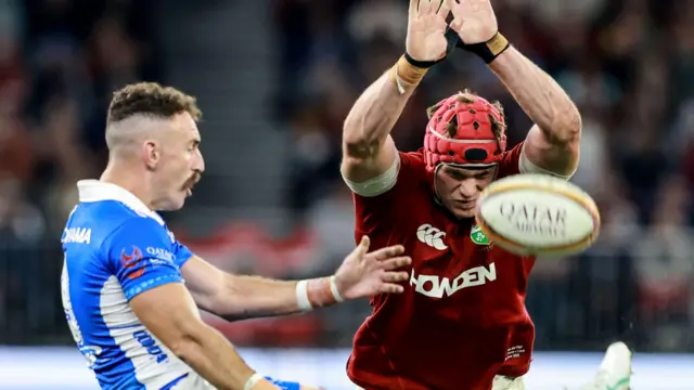British and Irish Lions Josh van der Flier attempts to block a Nic White box kick
