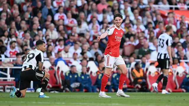 Declan Rice of Arsenal interacts with Bruno Guimaraes of Newcastle 