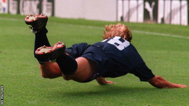 Jurgen Klinsmann celebrates scoring for Tottenham with a dive