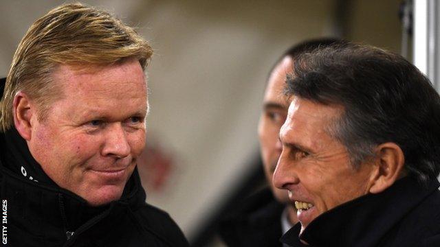 Southampton's former manager Ronald Koeman chats with Saints boss Claude Puyel before the game with Everton