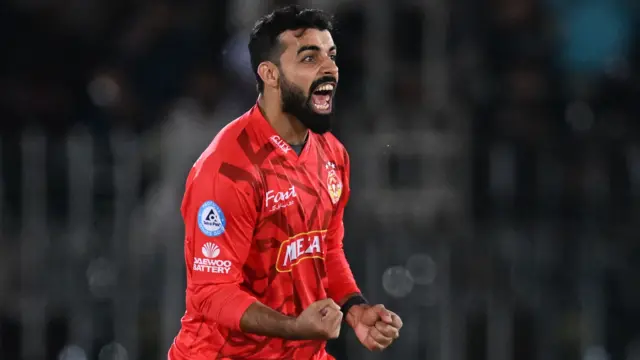 Islamabad United's captain Shadab Khan celebrates taking a wicket