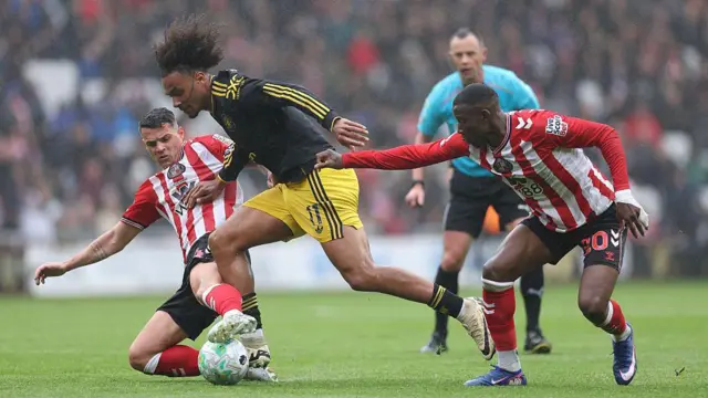 Joshua Zirkzee of Manchester United battles for possession with Granit Xhaka of Sunderland and Nordi Mukiele of Sunderland