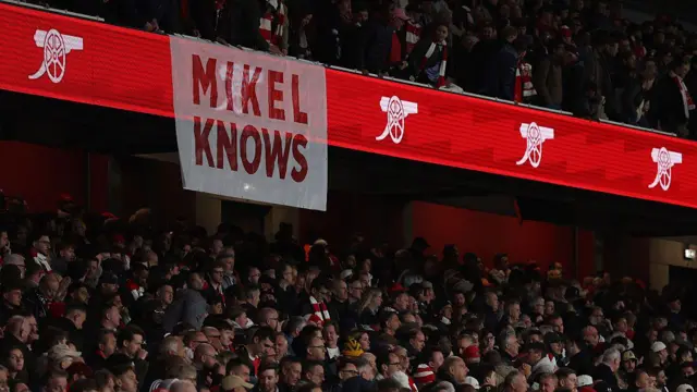 Arsenal fans display a sign saying 'Mikel Knows'