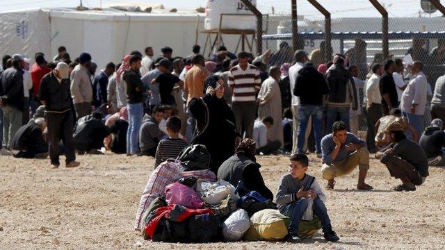 Syrians refugees wait to register their names to go back to their homeland at Al Zaatari refugee camp in the Jordanian city of Mafraq, near the border with Syria