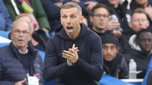 Gary O'Neil, clapping his team during the draw at Brighton