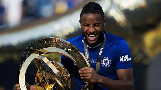 Christopher Nkunku poses with the Club World Cup trophy