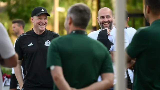 Eddie Howe laughs with Paul Mitchell