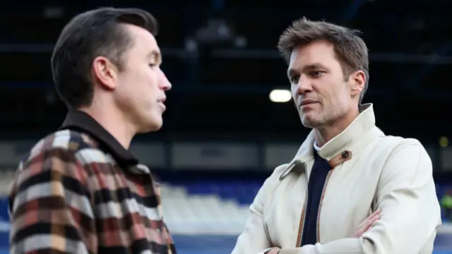 Rob McElhenney and Tom Brady chat before Wrexham's game at Birmingham last season