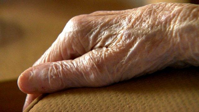 elderly person's hand