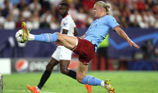 Erling Haaland scores for Manchester City against Sevilla