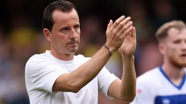 Julien Stephan, manager of Queens Park Rangers, applauds the fans