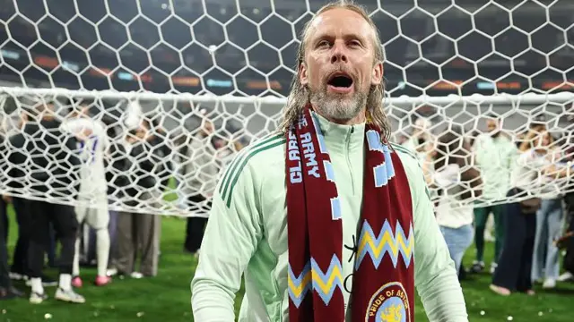 Austin MacPhee celebrating with Vilaa scarf around his neck