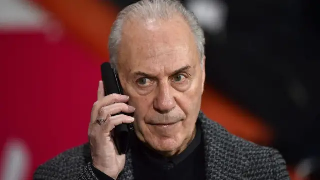 Bournemouth's former chairman Jeff Mostyn speaks on his mobile phone
