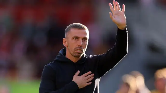 Manager Gary O'Neil gestures to the Wolves fans after his team's defeat at Brentford in the Premier League