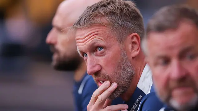 Graham Potter looks on throughtfully from the bench