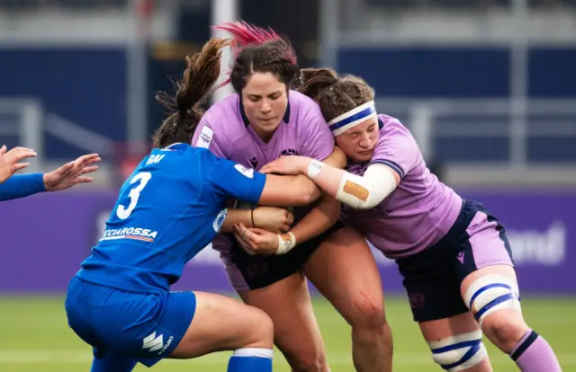 Christine Belisle and Rachel Malcolm in action against Lucia Gai during a TikTok Women's Six Nations match between Scotland and Italy at the DAM Health Stadium, on April 22, in Edinburgh, Scotland