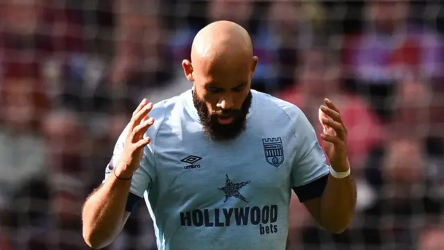 Brentford's French-born Cameroonian striker #19 Bryan Mbeumo celebrates after scoring his team second goal during the English Premier League football match between Aston Villa and Brentford