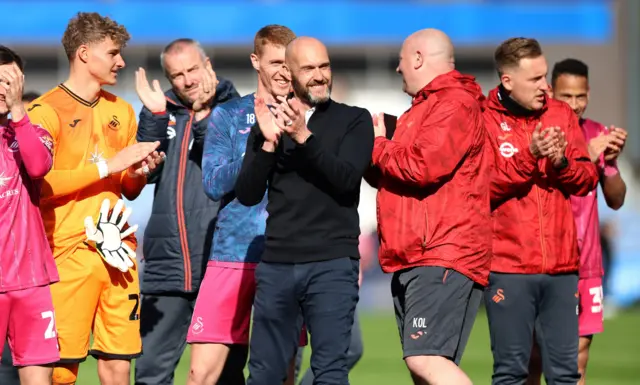 Luke Williams and his staff celebrate victory at Huddersfield