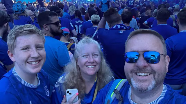 Supporters smiling outside Goodison Park 