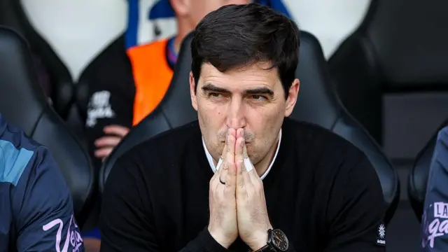 Andoni Iraola sits in his dugout